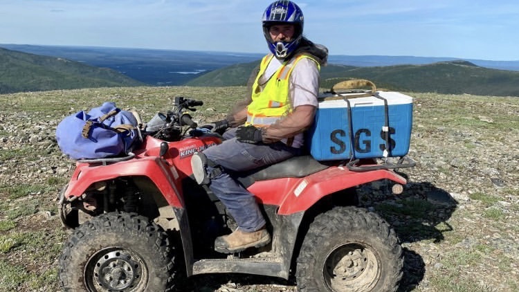 Kai Myers doing remote environmental field work in Alaska